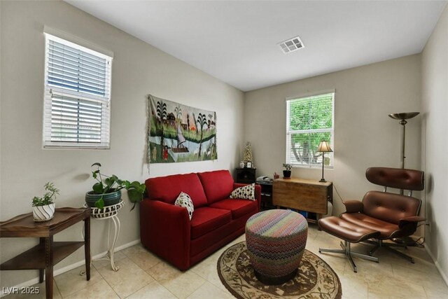 703 Shiva St, Las Vegas, NV 89178 - tiled living room with baseboards