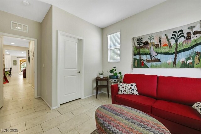 703 Shiva St, Las Vegas, NV 89178 - tiled living area featuring baseboards