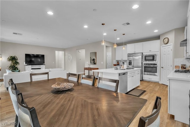741 Monroe Hill Pl, Henderson, NV 89011 - dining area featuring recessed lighting, light wood-style floors, and baseboards