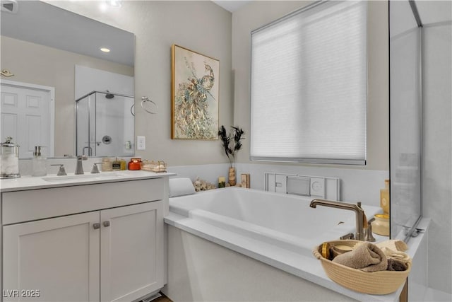 741 Monroe Hill Pl, Henderson, NV 89011 - bathroom with a stall shower, vanity, a garden tub, and healthy amount of natural light