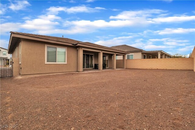 741 Monroe Hill Pl, Henderson, NV 89011 - rear view of house with a fenced backyard and stucco siding