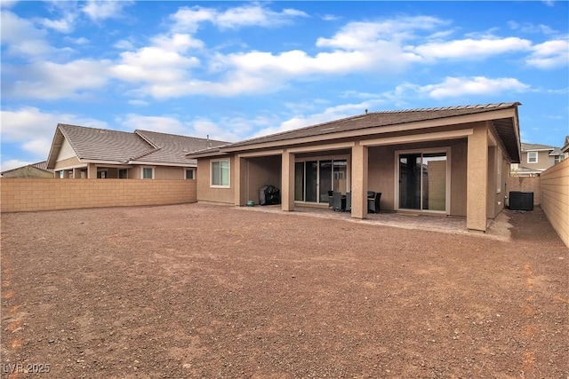 741 Monroe Hill Pl, Henderson, NV 89011 - back of property with a fenced backyard, stucco siding, and central AC unit