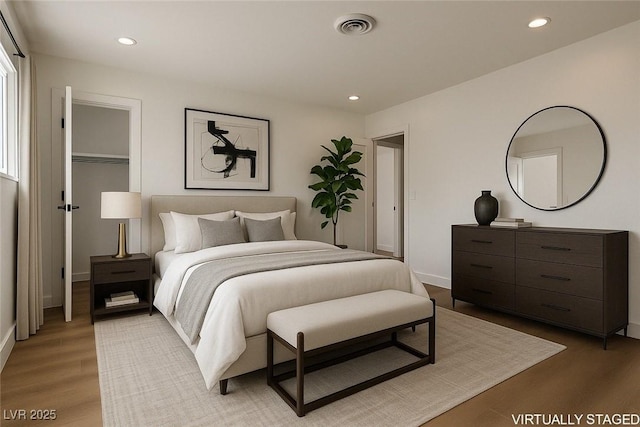 704 Slayton Dr, Las Vegas, NV 89107 - bedroom featuring light wood-type flooring, recessed lighting, and baseboards