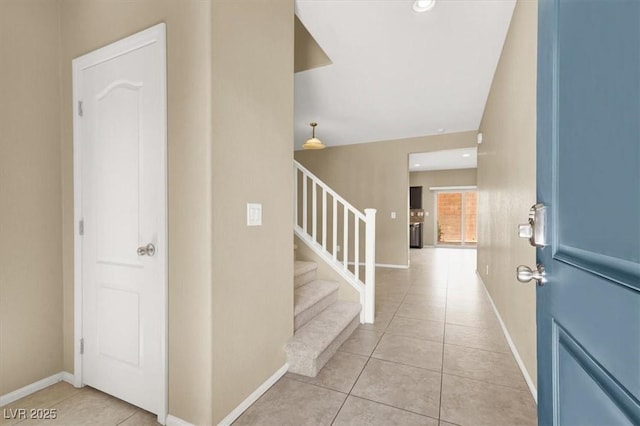 7931 Mineral Peak St, Las Vegas, NV 89166 - tiled entrance foyer featuring stairway and baseboards