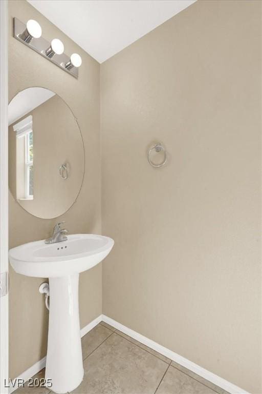 7931 Mineral Peak St, Las Vegas, NV 89166 - bathroom featuring baseboards, tile patterned floors, and a sink