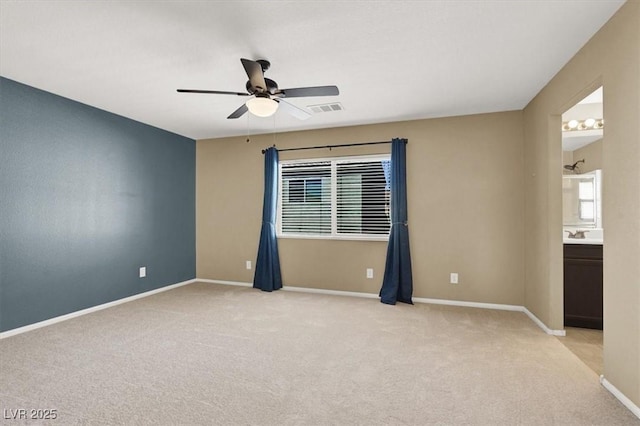 7931 Mineral Peak St, Las Vegas, NV 89166 - spare room with light colored carpet, a ceiling fan, and baseboards