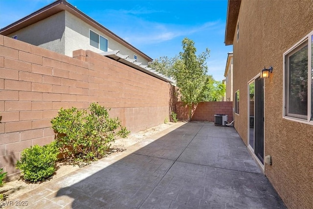 7931 Mineral Peak St, Las Vegas, NV 89166 - fenced backyard featuring a patio and central AC