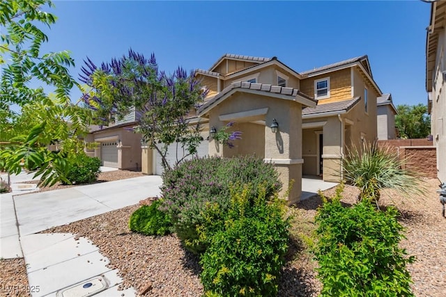 104 Big Cliff Ave, North Las Vegas, NV 89031 - view of front facade featuring stucco siding, a garage, and driveway