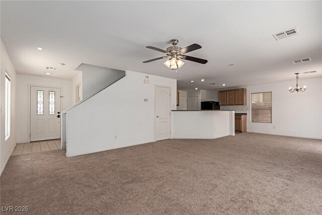 104 Big Cliff Ave, North Las Vegas, NV 89031 - unfurnished living room featuring light colored carpet, a chandelier, recessed lighting, and a ceiling fan