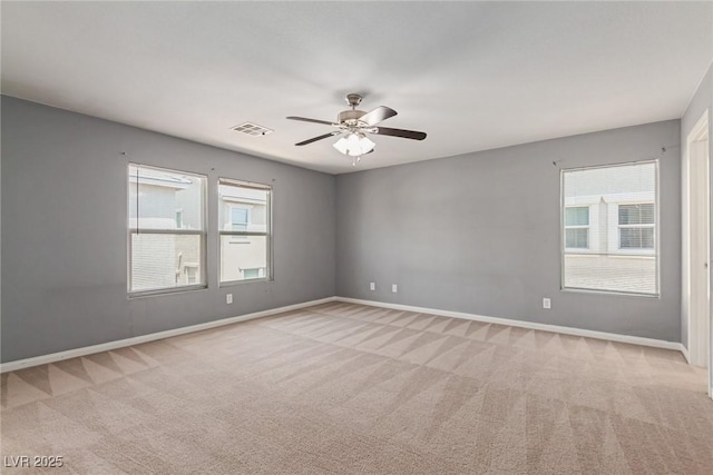 104 Big Cliff Ave, North Las Vegas, NV 89031 - spare room featuring light carpet, plenty of natural light, and a ceiling fan
