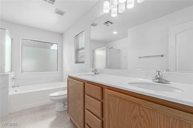 104 Big Cliff Ave, North Las Vegas, NV 89031 - full bath featuring tile patterned flooring, double vanity, a garden tub, a shower with shower door, and toilet