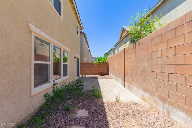 104 Big Cliff Ave, North Las Vegas, NV 89031 - fenced backyard with a patio