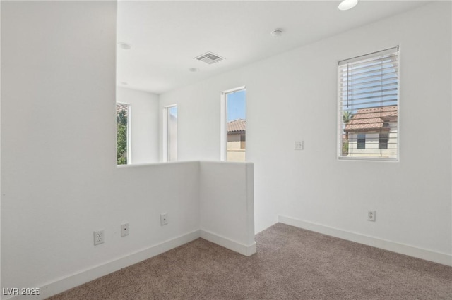 1043 Monte De Oro Ave, Las Vegas, NV 89183 - spare room featuring healthy amount of natural light, carpet flooring, and baseboards