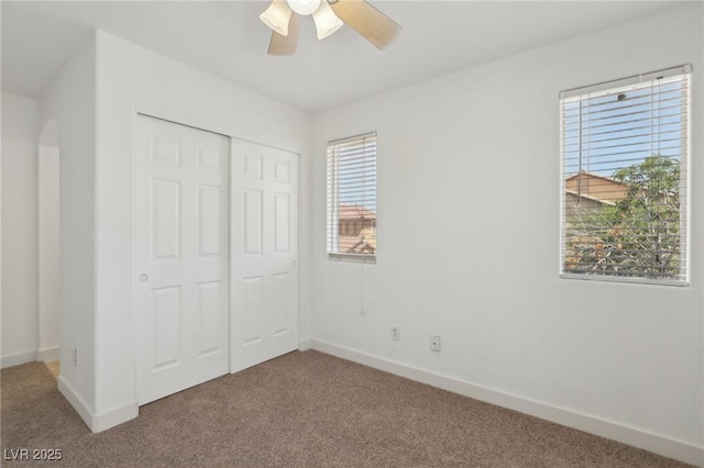 1043 Monte De Oro Ave, Las Vegas, NV 89183 - unfurnished bedroom featuring carpet, multiple windows, and baseboards