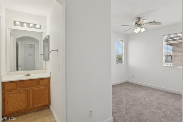 1043 Monte De Oro Ave, Las Vegas, NV 89183 - bathroom with a ceiling fan, vanity, and baseboards