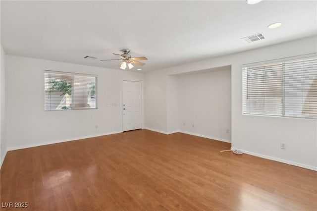 1043 Monte De Oro Ave, Las Vegas, NV 89183 - unfurnished room with a ceiling fan, wood finished floors, baseboards, and recessed lighting