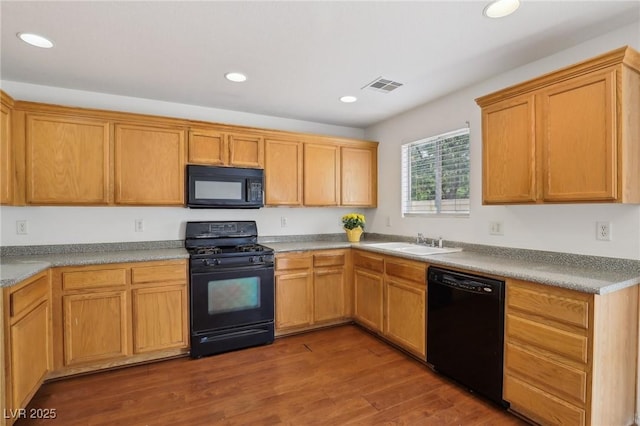 1043 Monte De Oro Ave, Las Vegas, NV 89183 - kitchen featuring black appliances, a sink, recessed lighting, and wood finished floors
