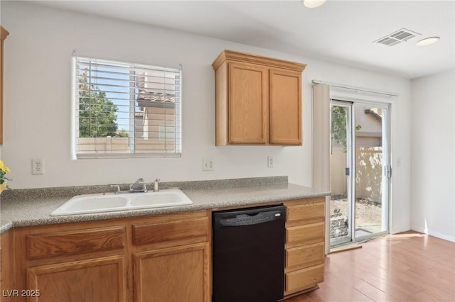 1043 Monte De Oro Ave, Las Vegas, NV 89183 - kitchen with dishwasher, a sink, and wood finished floors