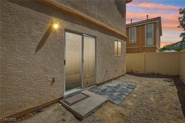 1043 Monte De Oro Ave, Las Vegas, NV 89183 - view of exterior entry featuring stucco siding and a patio