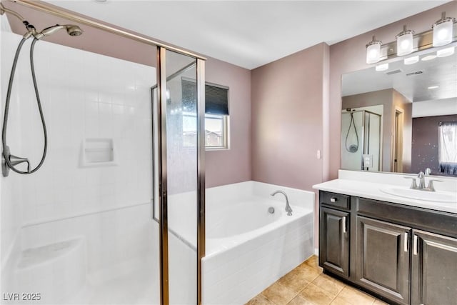 7624 Mallard Bay Ave, Las Vegas, NV 89179 - full bathroom with a stall shower, a garden tub, tile patterned floors, and vanity