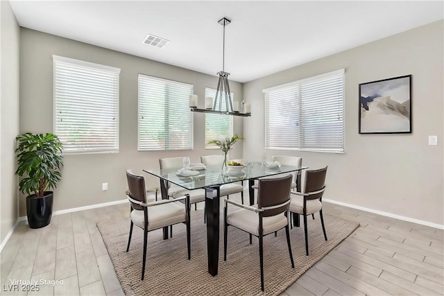 7624 Mallard Bay Ave, Las Vegas, NV 89179 - dining room with light wood-type flooring and baseboards