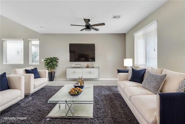 7624 Mallard Bay Ave, Las Vegas, NV 89179 - living room featuring ceiling fan, plenty of natural light, and baseboards
