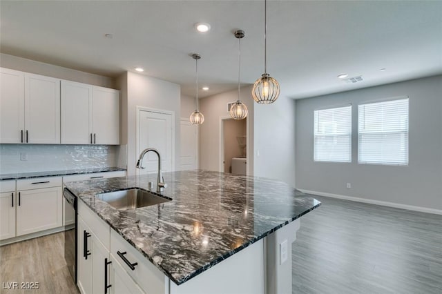 3270 Palindrome Ave, Henderson, NV 89044 - kitchen featuring a sink, light wood-type flooring, dishwasher, recessed lighting, and tasteful backsplash