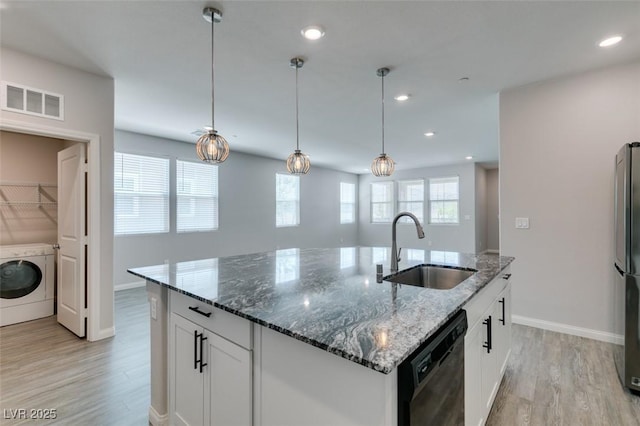 3270 Palindrome Ave, Henderson, NV 89044 - kitchen with a sink, washer / clothes dryer, dishwasher, light wood finished floors, and baseboards