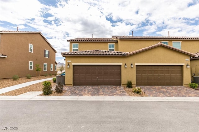 3270 Palindrome Ave, Henderson, NV 89044 - mediterranean / spanish house with stucco siding, driveway, and a garage
