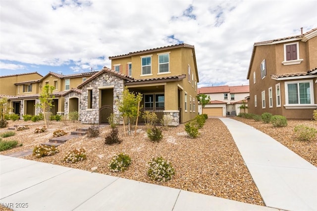 3270 Palindrome Ave, Henderson, NV 89044 - mediterranean / spanish-style house with stucco siding, stone siding, and a tiled roof