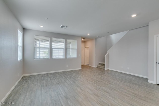 3270 Palindrome Ave, Henderson, NV 89044 - unfurnished living room featuring wood finished floors, stairs, baseboards, and recessed lighting