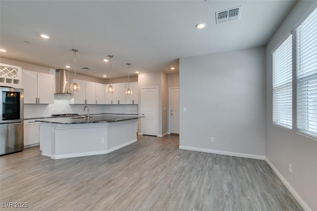 3270 Palindrome Ave, Henderson, NV 89044 - kitchen with smart refrigerator, wall chimney exhaust hood, plenty of natural light, backsplash, and recessed lighting