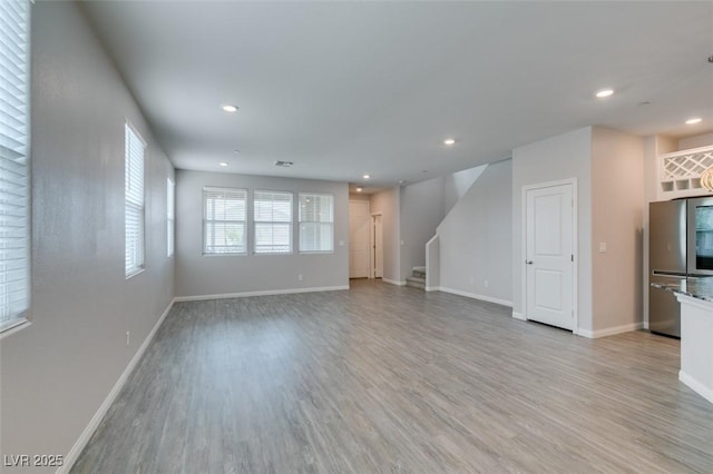 3270 Palindrome Ave, Henderson, NV 89044 - unfurnished living room featuring light wood finished floors, stairway, recessed lighting, and baseboards
