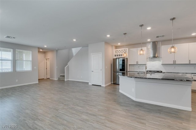 3270 Palindrome Ave, Henderson, NV 89044 - kitchen featuring smart refrigerator, wall chimney range hood, a center island with sink, recessed lighting, and light wood finished floors