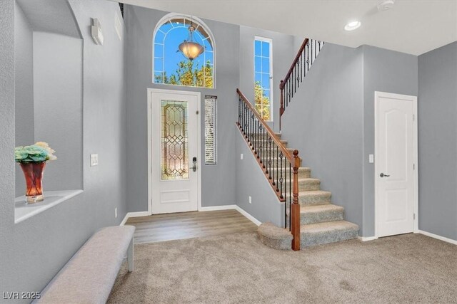 10845 Drake Ridge Ave, Las Vegas, NV 89166 - carpeted foyer featuring stairs, baseboards, and recessed lighting