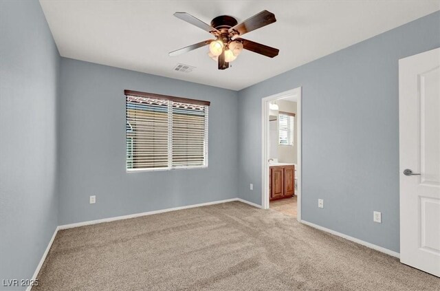 10845 Drake Ridge Ave, Las Vegas, NV 89166 - empty room with a ceiling fan, light colored carpet, and baseboards