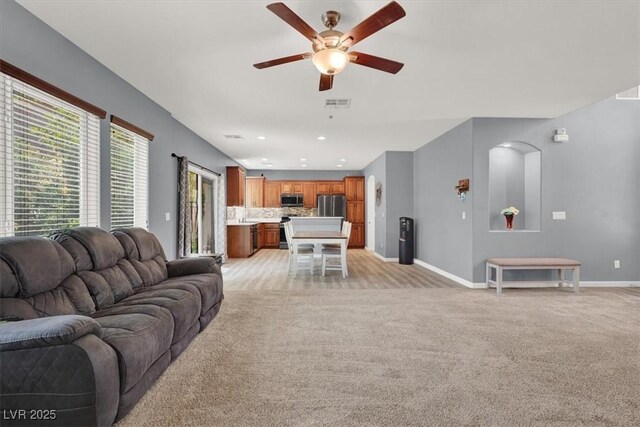 10845 Drake Ridge Ave, Las Vegas, NV 89166 - living room featuring light colored carpet, ceiling fan, baseboards, and recessed lighting