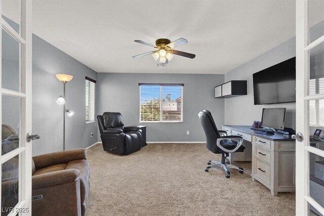 10845 Drake Ridge Ave, Las Vegas, NV 89166 - home office featuring french doors, ceiling fan, light carpet, and baseboards