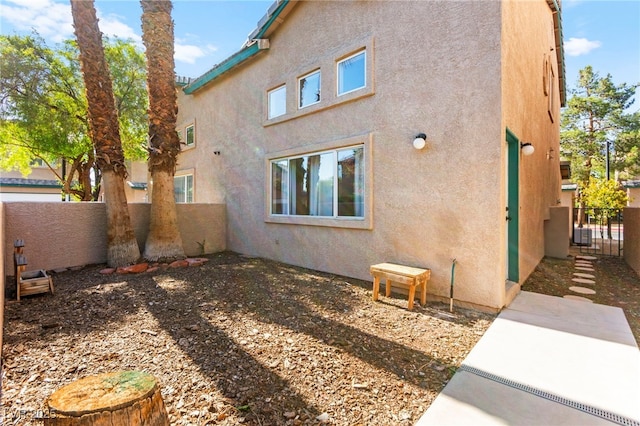 5615 Calais Ct, Las Vegas, NV 89118 - view of property exterior with stucco siding and a fenced backyard