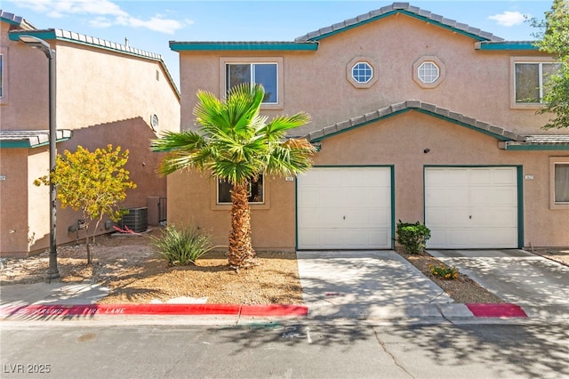 5615 Calais Ct, Las Vegas, NV 89118 - view of front of property featuring stucco siding, driveway, an attached garage, and cooling unit