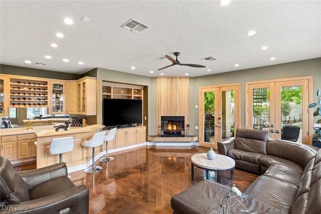 3004 Astoria Pines Cir, Las Vegas, NV 89107 - living room with recessed lighting, french doors, ceiling fan, and a fireplace
