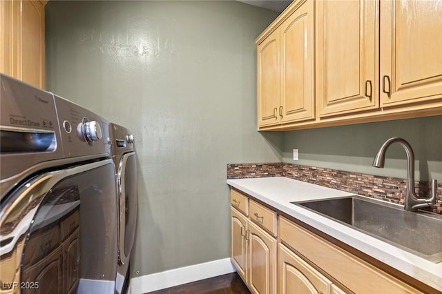 3004 Astoria Pines Cir, Las Vegas, NV 89107 - laundry room with cabinet space, baseboards, and washing machine and clothes dryer