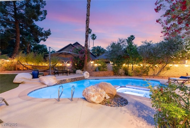 3004 Astoria Pines Cir, Las Vegas, NV 89107 - view of swimming pool featuring an in-ground hot tub, a patio area, and a fenced backyard