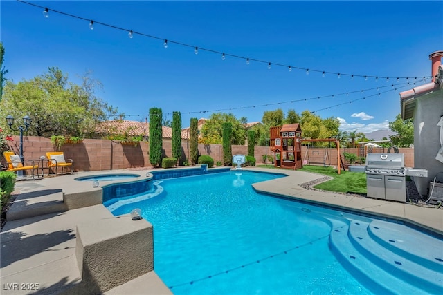 6423 Grayback Dr, North Las Vegas, NV 89084 - view of pool featuring a grill, a playground, a fenced backyard, a patio, and a pool with connected hot tub