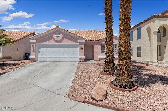 8316 Joseph Cary Ct, Las Vegas, NV 89145 - view of front of home with driveway, stucco siding, an attached garage, and a tiled roof