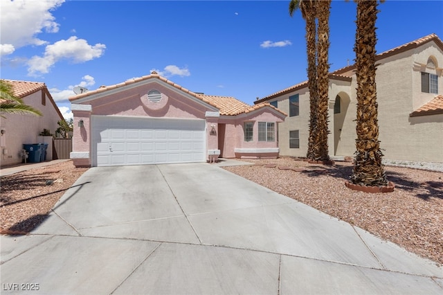 8316 Joseph Cary Ct, Las Vegas, NV 89145 - view of front of property featuring a tiled roof, concrete driveway, a garage, and stucco siding