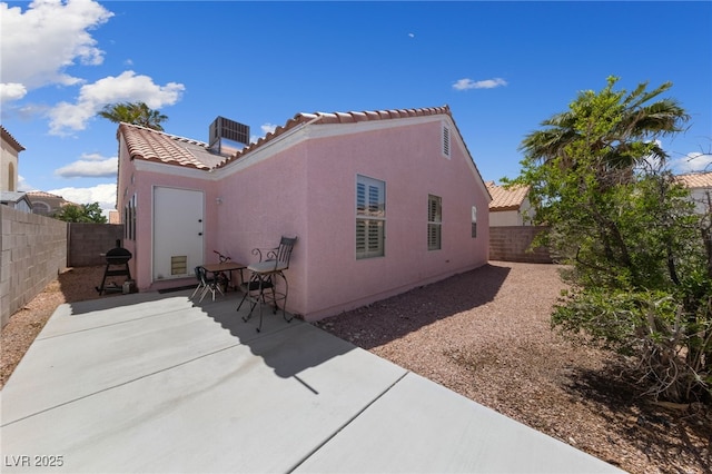 8316 Joseph Cary Ct, Las Vegas, NV 89145 - view of property exterior featuring cooling unit, a tiled roof, a patio, and stucco siding