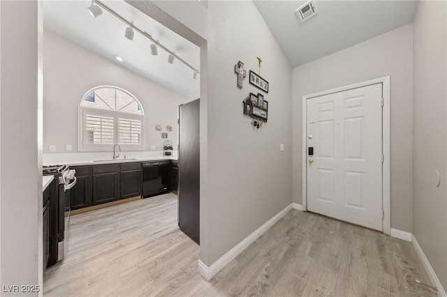 8316 Joseph Cary Ct, Las Vegas, NV 89145 - corridor featuring a sink, light wood finished floors, baseboards, and lofted ceiling