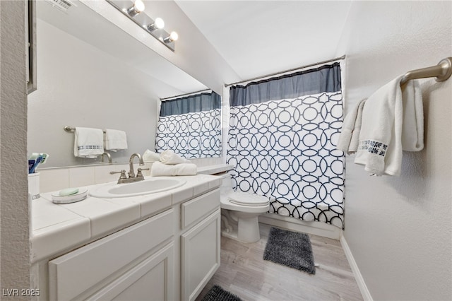8316 Joseph Cary Ct, Las Vegas, NV 89145 - bathroom featuring wood finished floors, toilet, and vanity