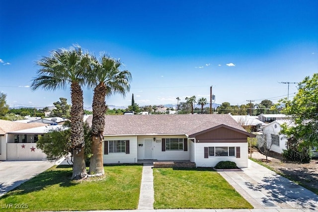 633 5th St, Boulder City, NV 89005 - ranch-style house featuring a front lawn, driveway, and roof with shingles